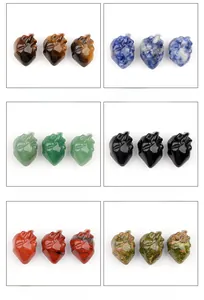 Detail view of six natural crystal anatomical heart carvings in a grid layout