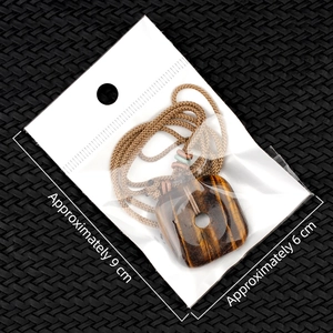 Tiger eye natural crystal square pendant with brown woven cord in protective packaging
