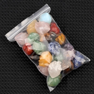 Mixed natural gemstone mini skull carvings in a bulk package for Halloween decor