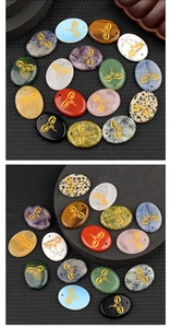 Macro detail of natural crystal palm stones with golden engraved All Seeing Eyes symbols