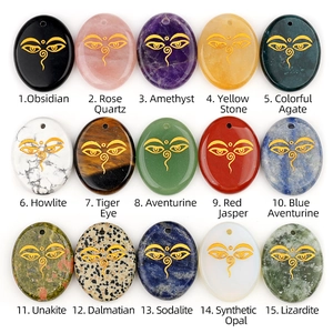Collection of 15 natural crystal palm stone pendants with golden all-seeing eye engraving