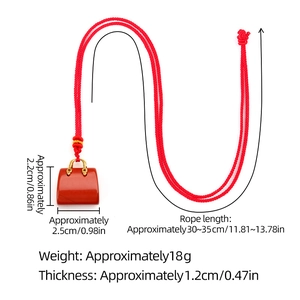 Rode agaat stenen tas hanger ketting met rood gevlochten koord en maataanduidingen