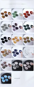 Macro detail of various polished natural crystal worry stones with thumb grooves