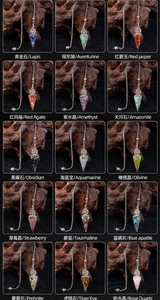 Macro shot of resin tree of life pendants with natural healing crystals and silver chains
