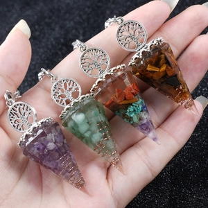 Set of four resin crystal cone pendants with Tree of Life symbol and copper coil elements