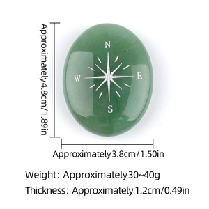 Green aventurine crystal stone with silver compass engraving for meditation and healing