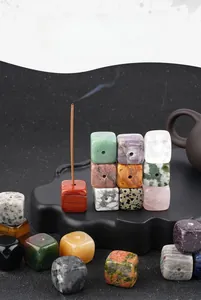 Macro detail of cube-shaped natural crystal incense holder with colorful gemstone textures