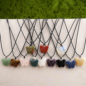 Various carved gemstone butterfly pendant necklaces in assorted natural crystal stones