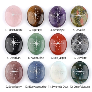Polished natural crystal palm stones set with engraved silver compass symbols in 12 styles
