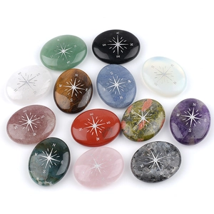 Set of 12 natural crystal palm stones with silver engraved compass star patterns