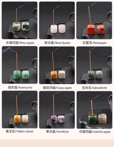 Macro detail of various natural gemstone incense holders in a minimalist zen setting