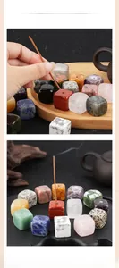 Detailed view of square natural crystal incense stick holders in various semi-precious stones