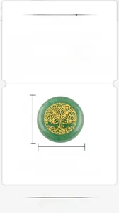 Detailed view of 25mm green agate stone disk with gold engraved tree of life symbol