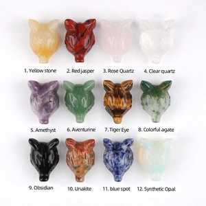 Set of 12 hand-carved natural crystal fox head figurines in various gemstones