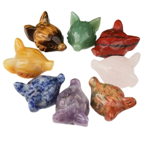 Assorted natural gemstone fox head carvings including amethyst, quartz, and tiger eye stones