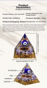 Detailed view of a 6cm Orgone Pyramid with amethyst stones and the evil eye symbol
