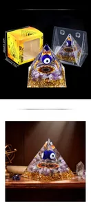 Detailed view of 6cm amethyst evil eye pyramid with gold leaf and Egyptian themed packaging