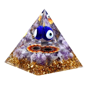 Evil Eye resin pyramid with crushed amethyst and gold foil for desk decor