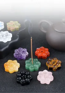 Close-up of assorted natural crystal lotus incense holders in various gemstone textures