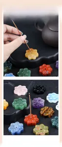 Macro detail of lotus shaped crystal incense stick holder in various natural gemstones