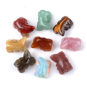 Set of hand-carved 1-inch assorted crystal and agate lizard figurines on white background