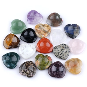 Variety of polished heart-shaped crystal worry stones in natural gemstone materials