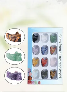 Macro detail of twelve natural crystal gemstone wolf head carvings in a gift box display