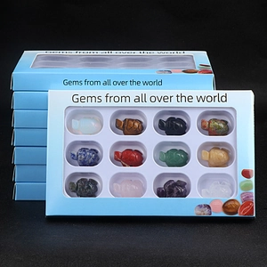 Set of 12 hand-carved gemstone turtles including tiger eye and amethyst in gift box
