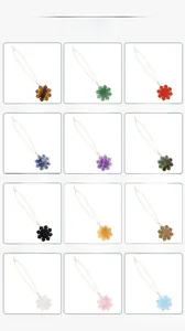 Detailed grid of 12 natural stone snowflake pendants including tiger eye and amethyst