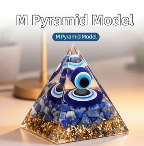 Detailed macro view of an Evil Eye Pyramid model with gold foil and lapis lazuli stones