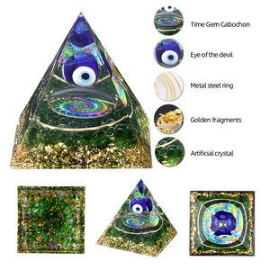 Evil Eye Orgone Energy Pyramid with Lapis Lazuli and golden foil layers for desktop decor