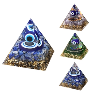 Blue evil eye orgonite pyramid handmade with lapis lazuli stones and gold foil
