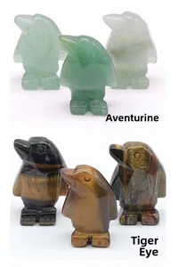 Detail of penguin carvings in Green Aventurine and Tiger Eye natural gemstones