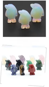 Detailed view of miniature penguin carvings crafted from diverse semi-precious gemstones