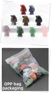 Close-up of assorted crystal penguin figurines showing various natural gemstone textures