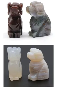 Detail of hand-carved agate puppy figurines in India agate and white agate stones