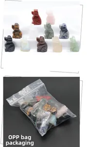 Detailed view of assorted natural gemstone puppy figurines in clear OPP bag packaging