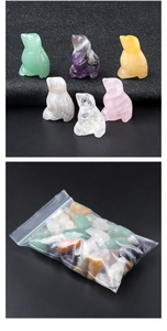 Macro shot of assorted natural gemstone penguin figurines in bulk transparent packaging