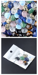 Macro view of assorted heart-shaped faceted crystal beads and their retail packaging