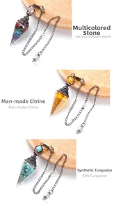 Detailed view of resin dowsing pendulums with seven-color stone and synthetic crystals