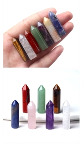 Detailed macro of seven chakra natural crystal points including amethyst and tiger eye