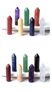 Detailed close-up of seven natural hexagonal crystal wands showing polished stone textures