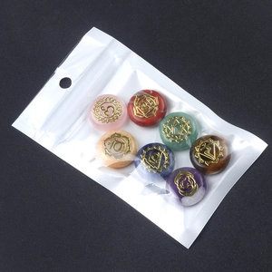 7Pcs chakra healing crystals set with engraved gold symbols on flat round stones