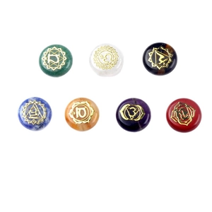 Seven chakra balancing stones set with engraved gold symbols on polished natural crystals