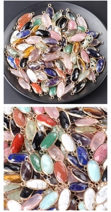 Detailed close-up of faceted oval gemstone connectors with metal frames for jewelry DIY