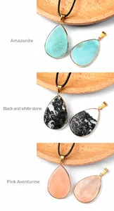 Detailed view of water drop stone pendants with gold plating and black necklaces