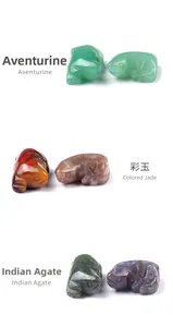 Detailed view of hand-carved lizard figurines in aventurine, jade, and agate stone