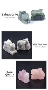 Detailed carvings of natural labradorite, white crazy agate, and rose quartz rabbit figurines