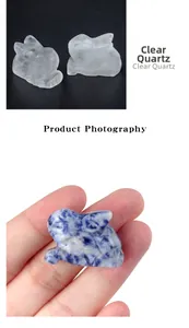 Detailed view of hand-carved clear quartz and blue stone bunny rabbit figurines