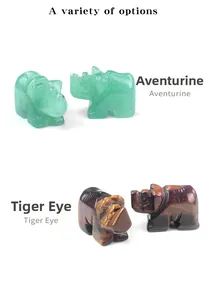 Detailed comparison of mini green aventurine and tiger eye stone rhinoceros carvings